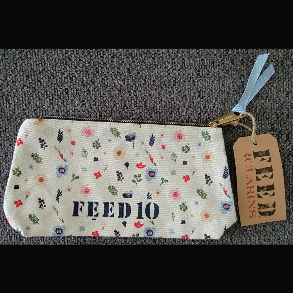 BNWT Clarins FEED 10 Woman On A Mission Flower Cosmetic Bag